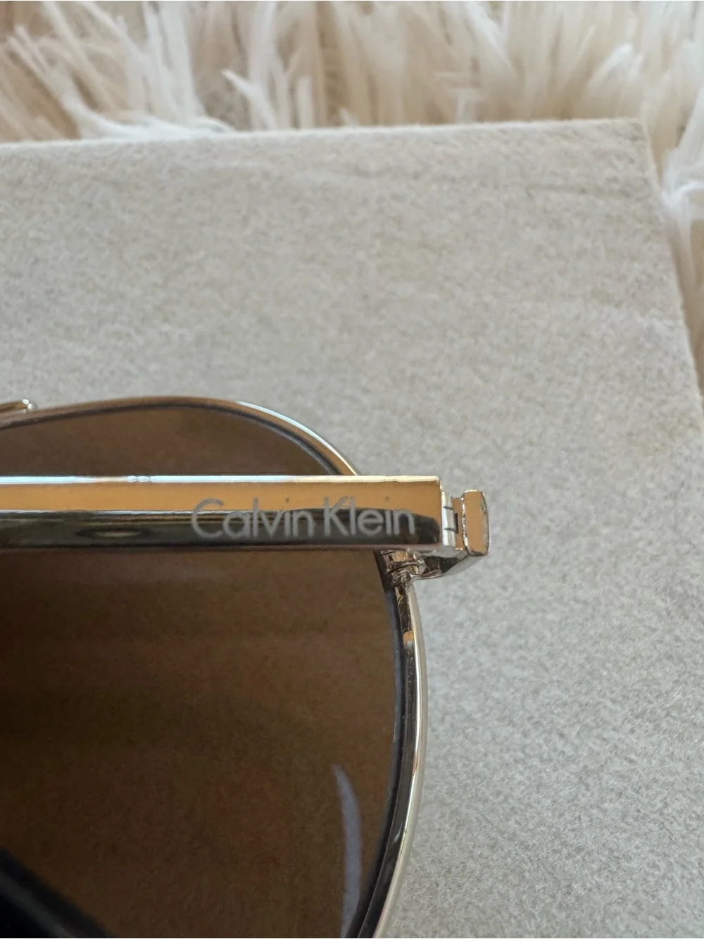 Calvin Klein Gold Unisex Aviator Sunglasses with Brown Lenses